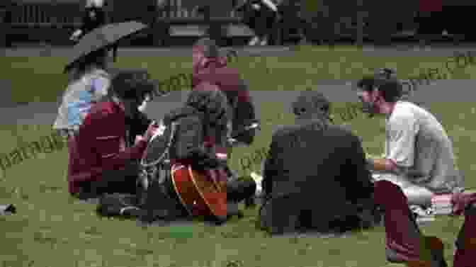 A Documentary Filmmaker Interviewing A Subject In A Community Setting, Highlighting The Participatory Nature Of The Film. Documentary S Expanded Fields: New Media And The Twenty First Century Documentary