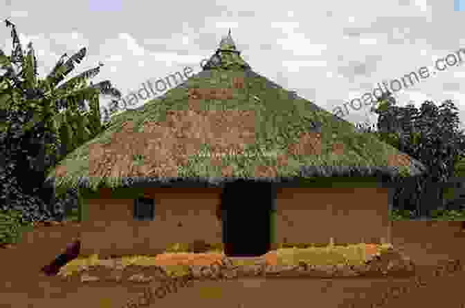 A Panoramic View Of A Traditional African Village With Thatched Huts And Lush Vegetation JoJo And The Adinkroes Jodi Twum Barima